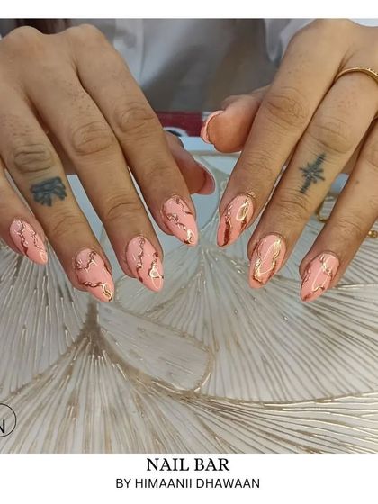 Another example of our pink and gold marble nails, showing how each set is unique.