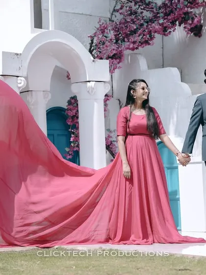 A dramatic, high-fashion pre-wedding shot featuring a flowing pink gown. I can help style and execute these "music video" type concepts to make your shoot unique.