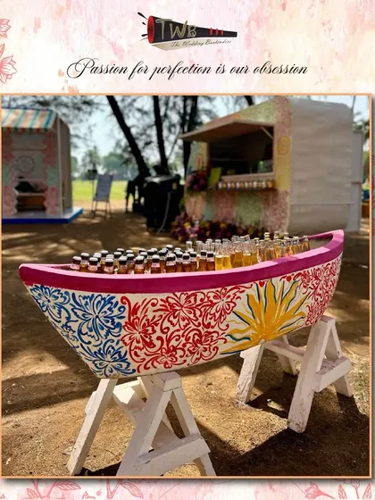 A creative and thematic shot station designed in the shape of a colorfully painted boat for a beach wedding at ITC Goa. It’s a unique touch that adds a fun, local flavor to the celebration.