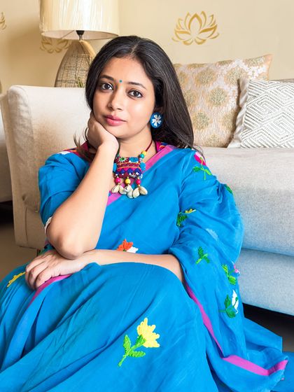 A close-up portrait. This look is all about celebrating the joy of wearing something beautiful and comfortable. A saree can and should be everyday wear.