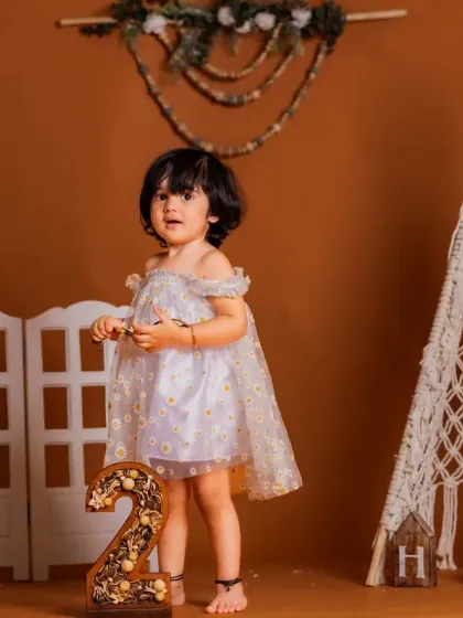 Celebrating a second birthday with a boho twist. The rustic number '2' complements the theme perfectly.