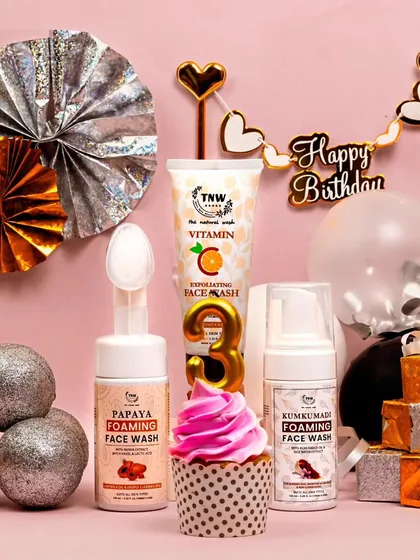 A different take on the birthday celebration, this time with a pink and silver color scheme. The composition is playful and glamorous, with shiny ornaments and decorative fans.