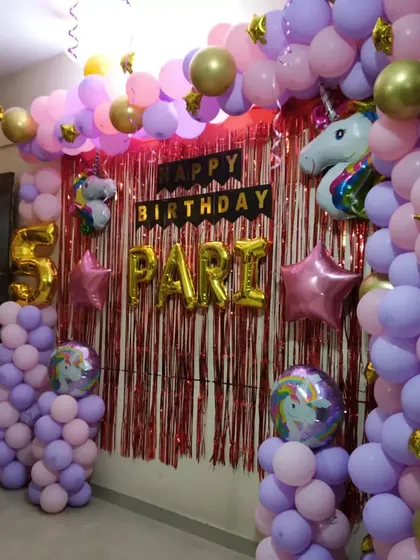 A side view of the Unicorn theme balloon arch, showing the depth and layering of the balloons.