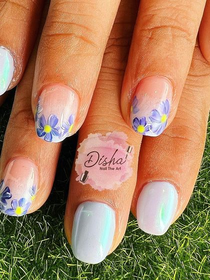 Hand-painted flowers in their most organic form. This lovely design features a pearlescent white base with delicate, free-flowing purple flowers.