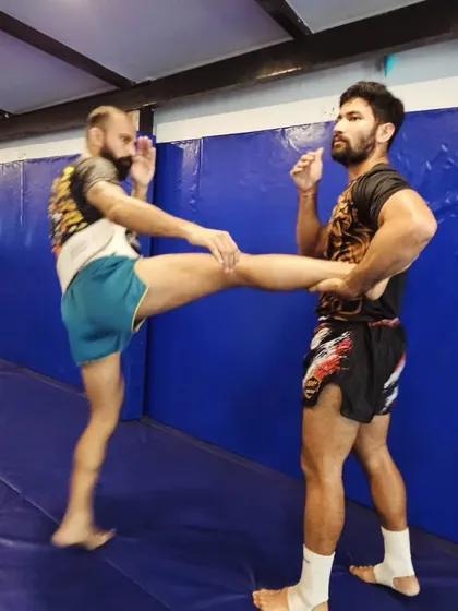 A perfect demonstration of a teep kick during our Muay Thai masterclass. We focus on clean, effective striking fundamentals, teaching you how to use distance and timing to control the fight. This is a core skill for any striker.