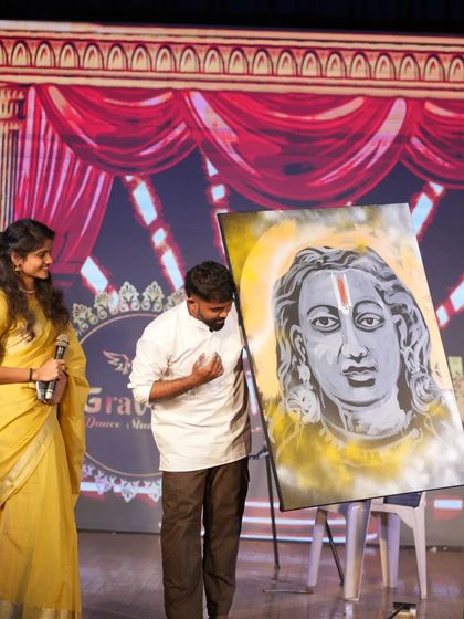 On stage at the Advaya Dance Festival after completing my upside-down painting of Lord Sriram.