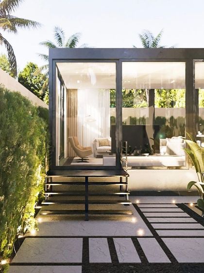 Another daytime perspective of the patio lounge, highlighting the clear glass walls that provide an uninterrupted view of the surrounding greenery, making you feel connected to nature.