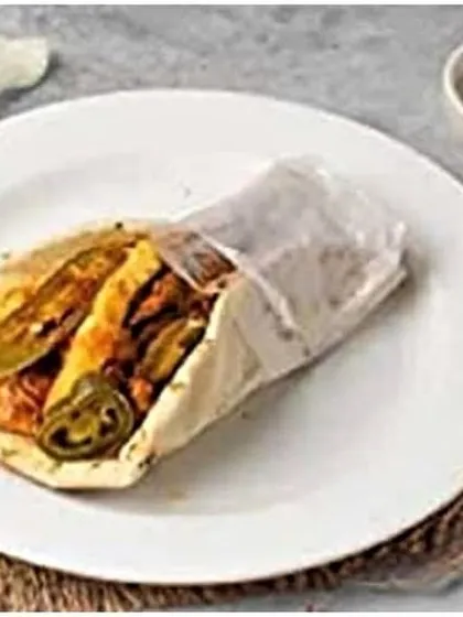 A close-up of the Mexican shawarma roll, highlighting the sliced jalapeños that give it a distinct, spicy flavor profile.