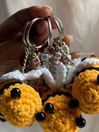 A handful of my customized bee keychains. This shows how they look in a bundle, perfect for anyone looking for unique, handmade party favors.