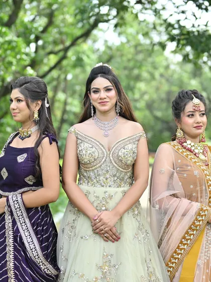 Dressing up is always more fun with friends. This photo shows three different styles from my collection side-by-side: a modern reception gown, a traditional bridal guest lehenga, and a chic striped lehenga, proving I have something for everyone in the wedding party.