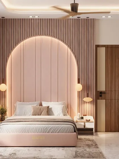 A Scandinavian-themed master bedroom with a stunning arched, quilted headboard. The walls feature PVC louvers, and the opposite wall includes a fluted TV console and a dressing table with an arched mirror.