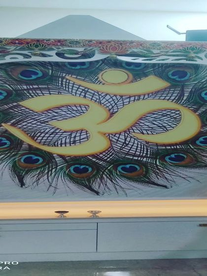 A custom printed roller blind I created for a puja room, featuring an 'Om' symbol with peacock feathers. If you have a specific design or image in mind, I can print it on a blind for you.