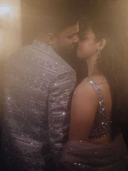 A dreamy, soft-focus portrait of the couple, creating an intimate and romantic mood.