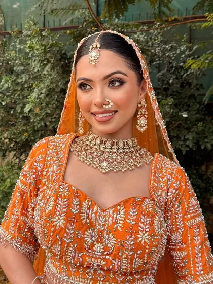 This portrait captures the bride's bright and happy energy. The makeup is flawless, ensuring she looks perfect from every angle.