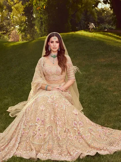 A breathtaking wide shot of the bride in a beautiful garden setting. The soft and dewy makeup looks fresh and timeless in the natural light.