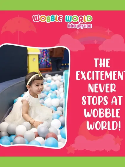 A sweet moment captured in the ball pit. Even the quiet moments here are filled with wonder and delight.