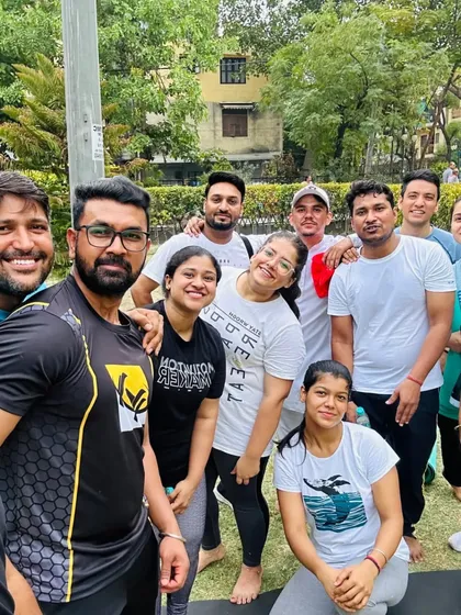 A close-up group selfie capturing the joy and camaraderie of a community yoga class.