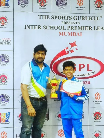 Kathit Shah receiving his winner's trophy at the Interschool Premier League. School sports are a vital part of a young athlete's development.