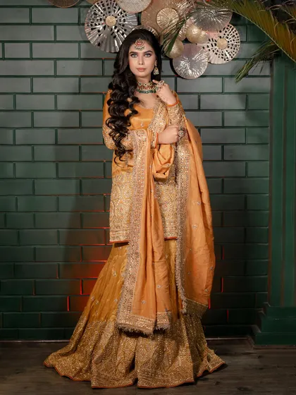 A full view of a stunning party look. I created soft, cascading curls that frame the face beautifully and complement the client's elegant lehenga. This style is all about achieving a glamorous, open-hair look that lasts all night.