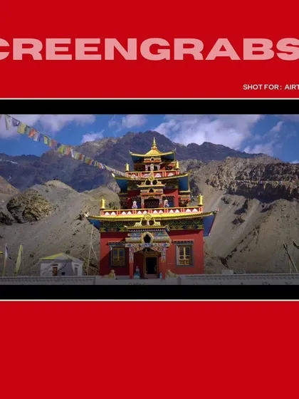 A wide, cinematic shot of a monastery in Spiti Valley, establishing the unique and remote setting for the Airtel ad campaign.