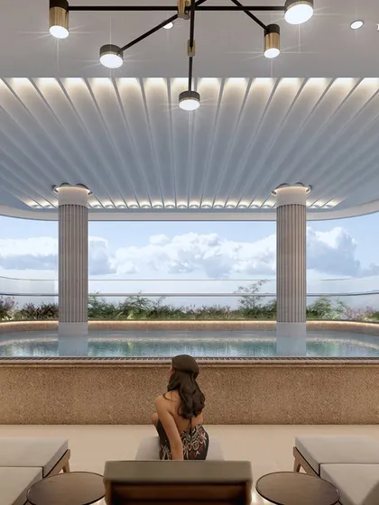 The serene poolside at a boutique apartment in Nagpur, surrounded by nature and offering sweeping views. The space features carefully selected tones and textures, including a beautiful mosaic wall, to create the perfect ambiance for luxury and tranquility.
