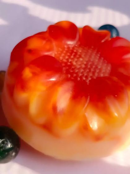 This vibrant, flower-shaped soap is a custom creation, showing the beautiful colors that can be achieved using only natural powders and ingredients.