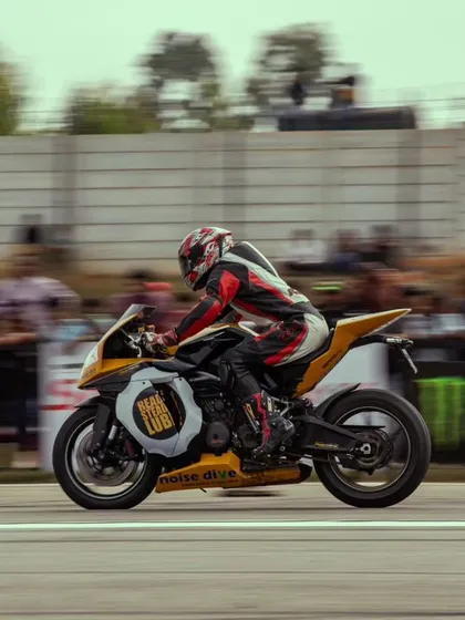 A yellow and black superbike, possibly an Aprilia, in full race mode. The variety of bikes on display is a testament to the diverse and passionate racing community we serve.