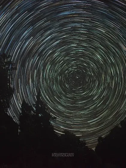 Capturing these star trails over the forests of Chopta meant spending a night in the freezing cold, but it was completely worth it. This is a long exposure photograph, a composite of many shots, that shows the Earth's rotation against the backdrop of the night sky.