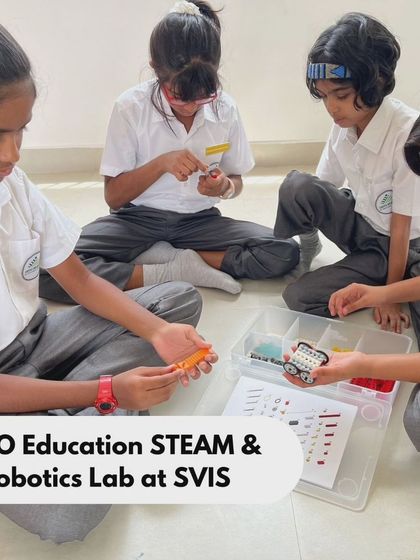 Teamwork in action at SVIS as students sort through LEGO parts and assemble their model. Our programs teach organization and systematic thinking through hands-on activities.