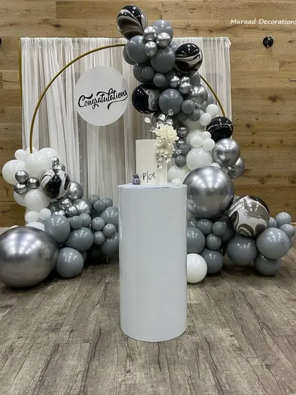 We provide elegant backdrops for all types of achievements and celebrations. This "Congratulations" setup features a sophisticated grey, white, and silver balloon arch, ideal for graduations, promotions, or corporate events.