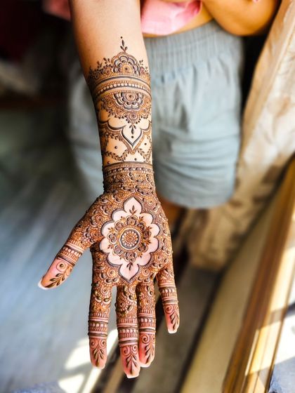 A single arm shot of a beautiful mandala-focused design, with elegant patterns extending up the arm.