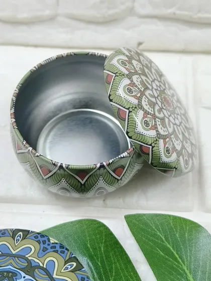 Our printed tin boxes come in various designs, like this green mandala pattern. They are a durable and reusable packaging option.