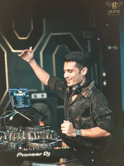 A candid moment from the console at Glitte Superclub, feeling the vibe of the crowd during a throwback set.