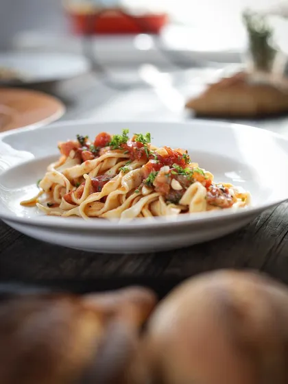 The end result of teamwork and fresh ingredients. A beautifully plated, handmade pasta dish, ready to be enjoyed. In our workshops, you don't just cook; you create culinary art that you get to savor.