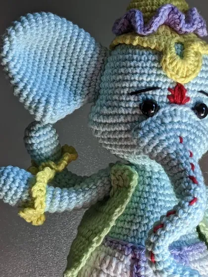 A detailed close-up of the Ganesha doll's face and trunk.