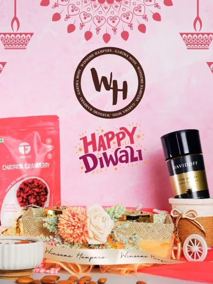 A delightful Diwali hamper featuring Davidoff coffee and chatpata cranberries. The items are beautifully arranged with floral accents and a miniature decorative bicycle, showcasing a blend of gourmet taste and whimsical charm.