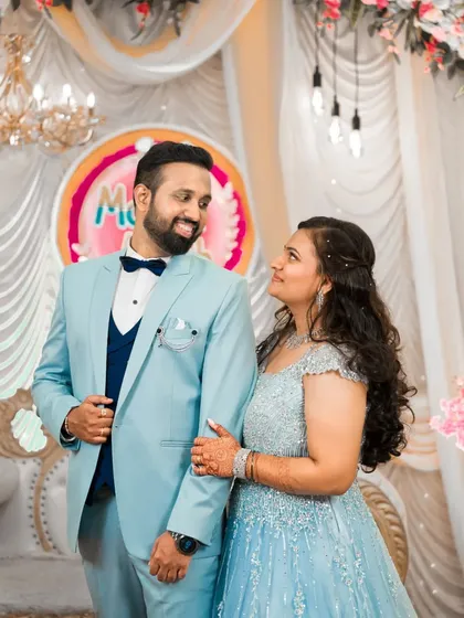 A candid moment of conversation and smiles between the couple at their engagement party.