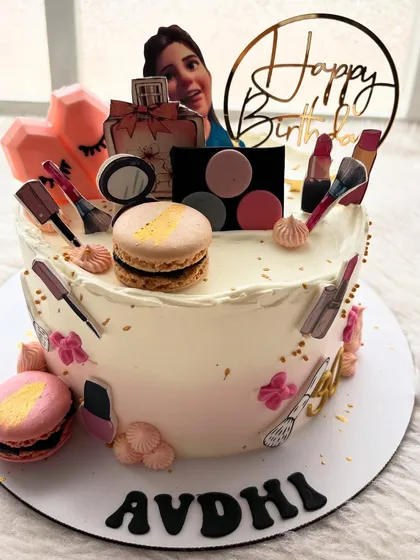 Another take on the makeup theme, this time with edible photo prints of makeup items, macarons, and a picture of the birthday girl.