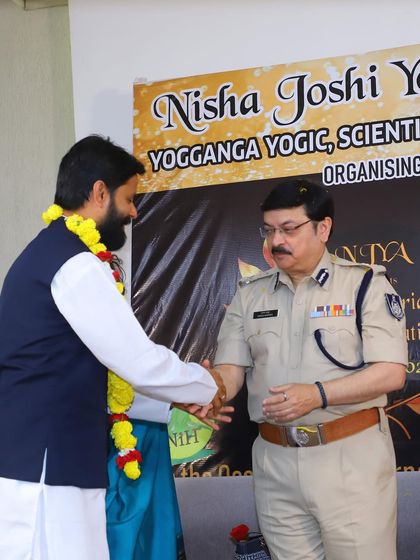 Receiving a token of respect at the Yog Ratn Award ceremony. It is humbling to be recognized by esteemed peers and organizations in the field of yoga.