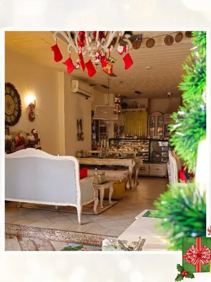 A peek at our cafe decorated for the holidays. The stockings hung from the chandelier and the Christmas tree in the corner add to the festive, merry moments.