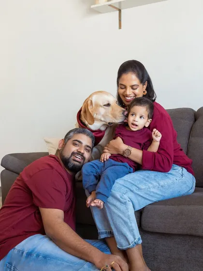 And then there were four. This is the kind of relaxed, love-filled family portrait I live to create, right in the comfort of your own home where everyone, including your furry friend, feels at ease.