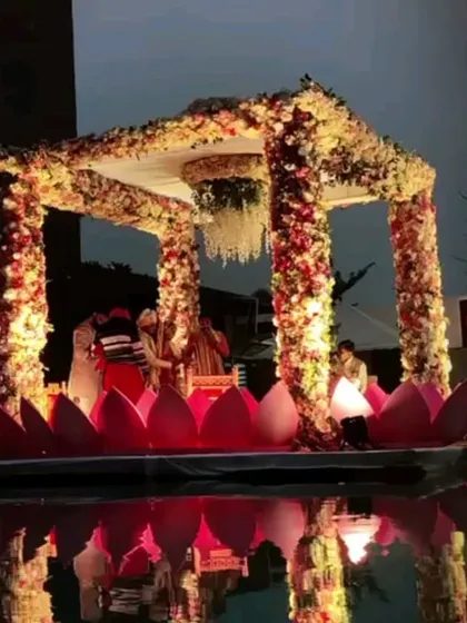 Imagine taking your vows on a mandap that floats on water. I specialize in bringing unique concepts like this floating lotus mandap to life, creating a truly magical and romantic setting for your wedding ceremony.