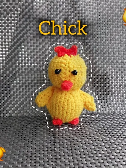 A cute little crochet chick with a red bow. This was based on a client's request to make the chick emoji come to life.