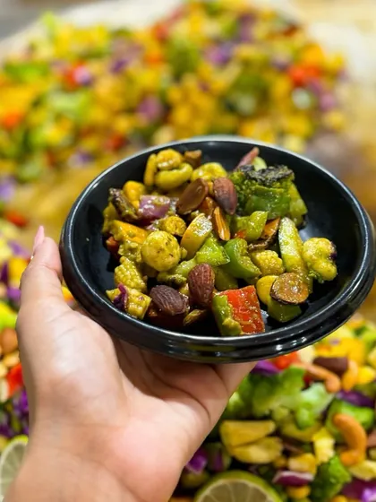 My English Vinglish Chaat is a healthy and delicious option. It's a vibrant mix of stir fried exotic vegetables and nuts, tossed in a zesty chutney for a guilt free yet satisfying snack.