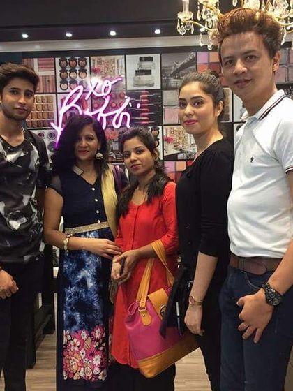 Posing with my students at a makeup store. I believe in providing a complete and practical education to my students.
