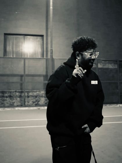 A black and white shot from the "CONTRL" promo. The focus is always on the next move.