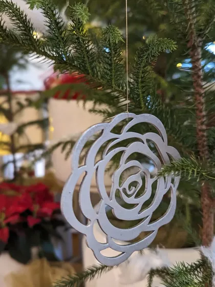 Another one of our unique, eco-friendly Christmas ornaments. This rose-shaped decoration is also crafted from recycled materials, proving that you don't need to harm the environment to create a beautiful and festive atmosphere.