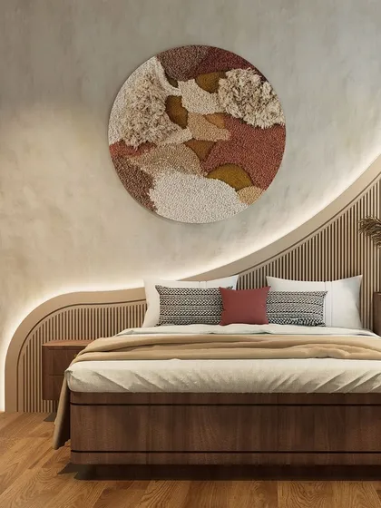 We designed this bedroom around organic forms and tactile surfaces. The custom-designed, wave-like headboard with integrated backlighting creates a soft, sculptural feature wall, complemented by the textured plaster and warm wood tones for a serene atmosphere.