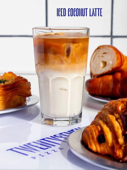 Our Iced Coconut Latte is a tropical twist on a classic, with creamy coconut milk layered with a strong shot of espresso.