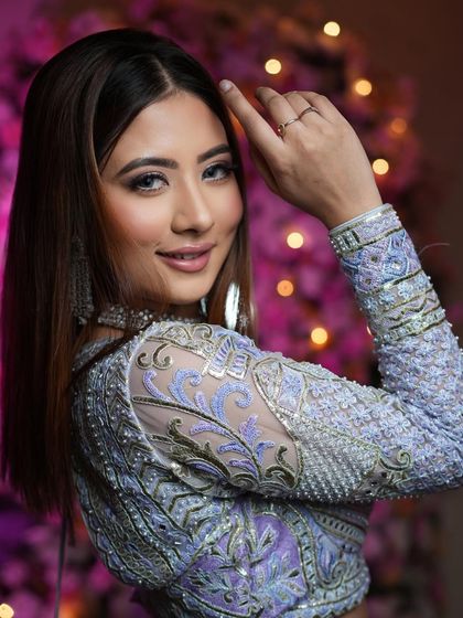 Breaking the internet with a sprinkle of quirkiness and a heap of confidence. This unique lavender lehenga is paired with a shimmery eye look for a standout reception style.